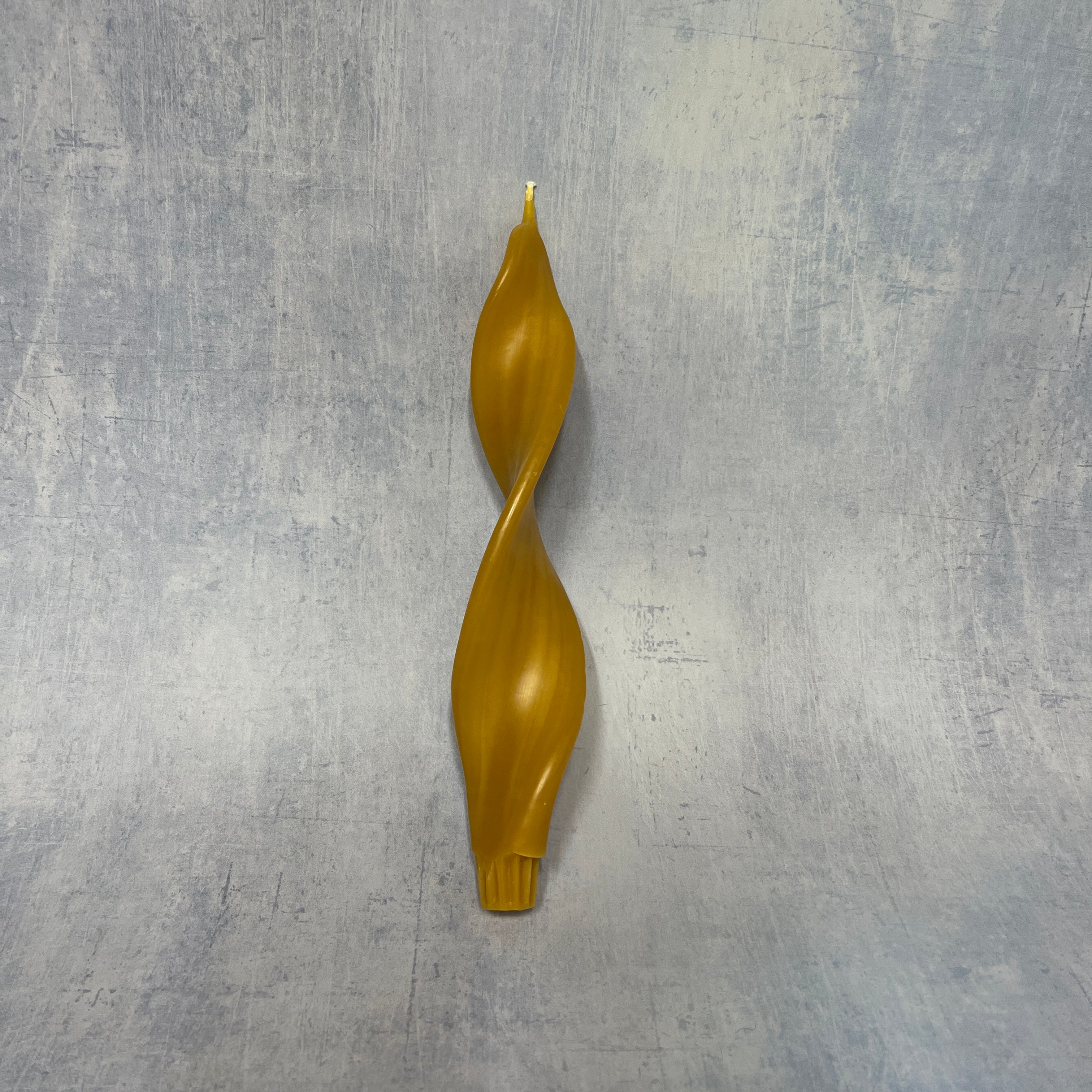 Winged beeswax candle